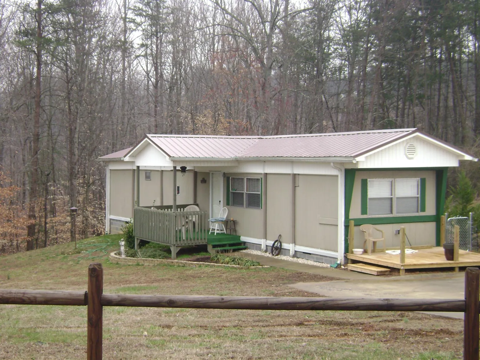 Mauve metal roof on a manufactured home with a new front deck in Brisbane